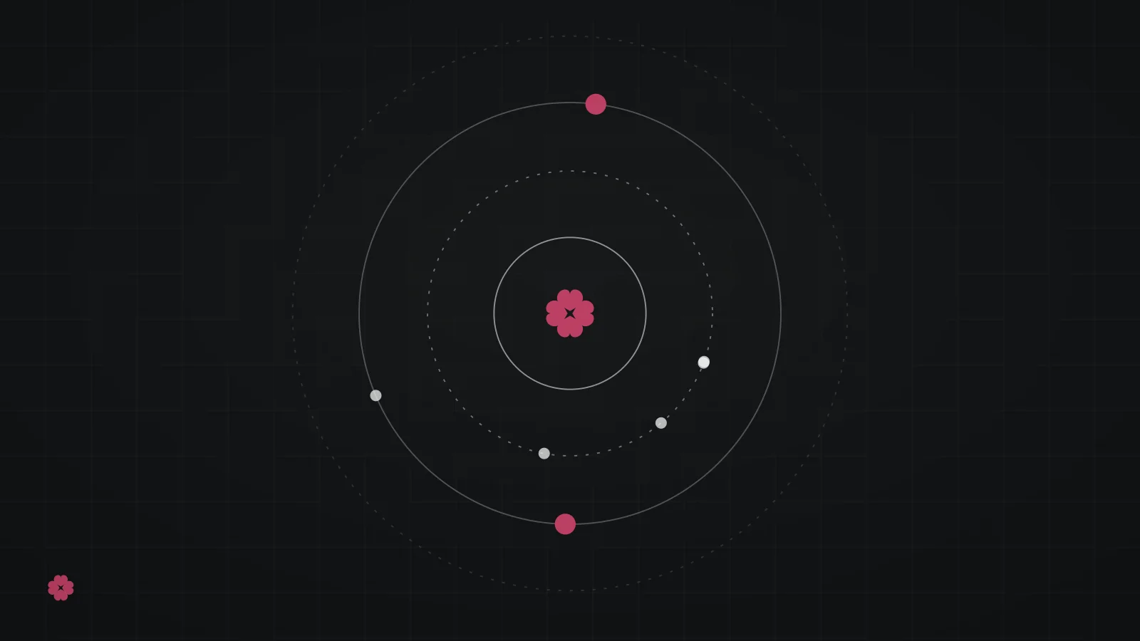 Abstract concentric orbit rings in raspberry on graphite.