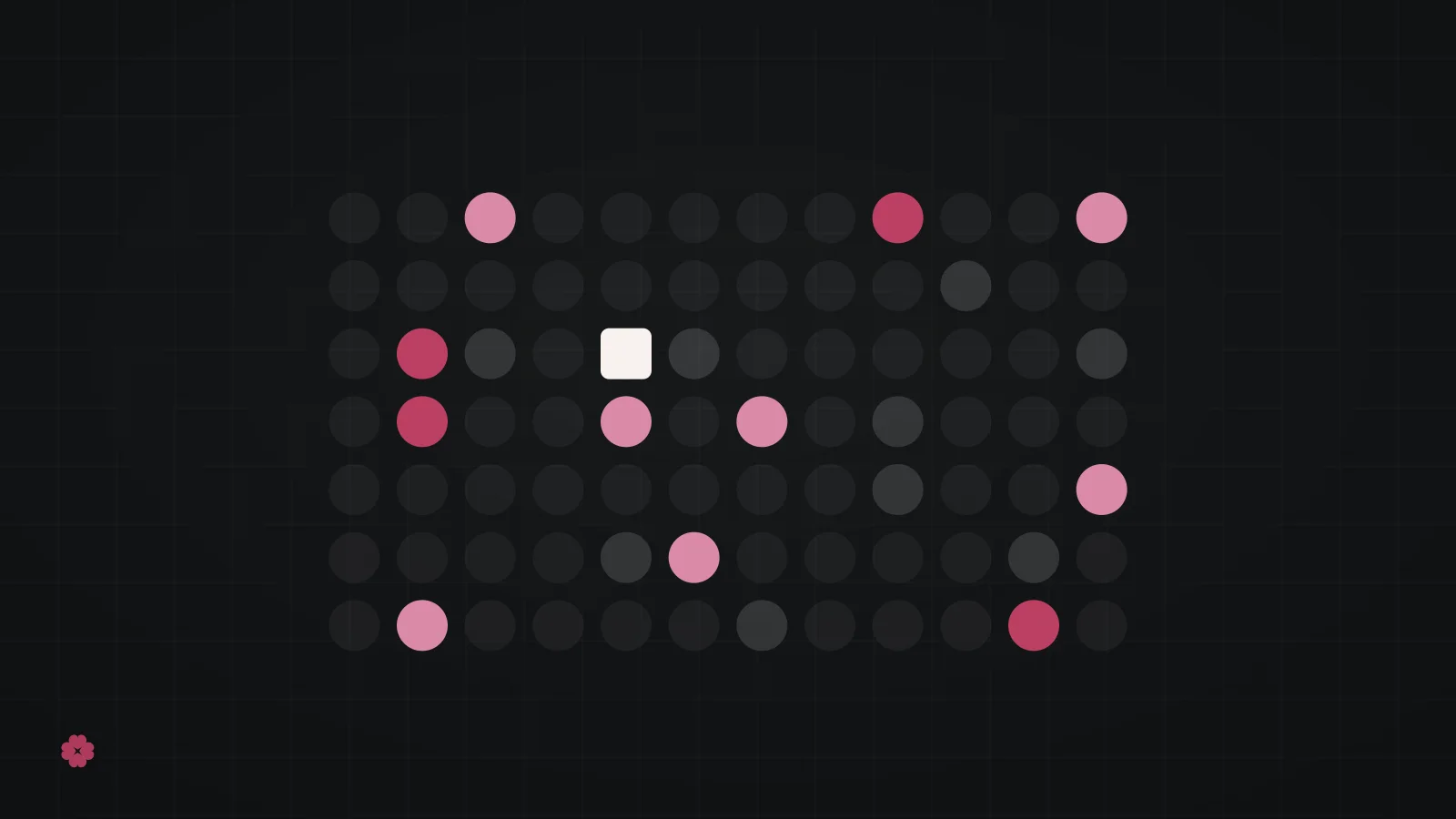 Abstract dot matrix motif in raspberry on graphite.